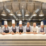 Onde kitchen brigade in front of Molteni kitchen