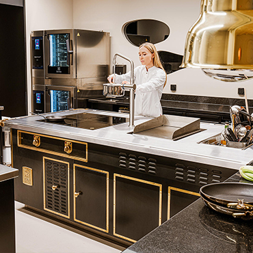 CAAA-restaurant-chef working on Molteni stove